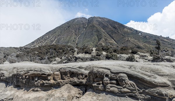 Faces carved into rock