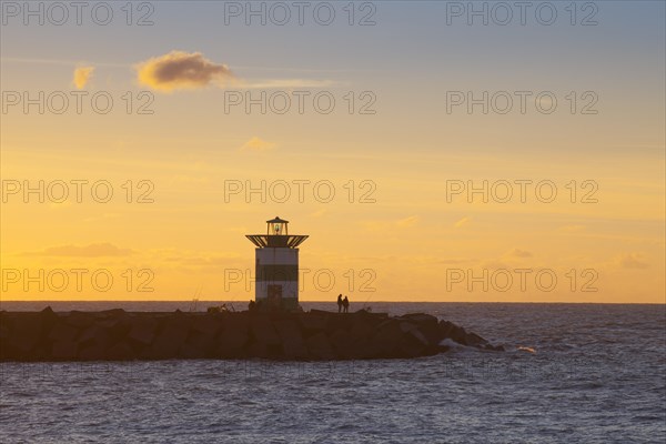 Small lighthouse at harbor entrance