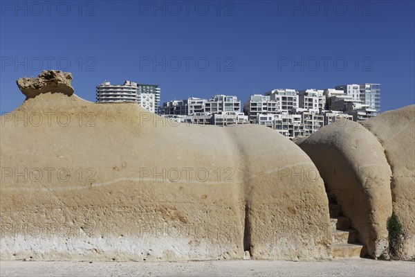 Ocher colored limestone sand formation at St. Elmo Bay from Valletta