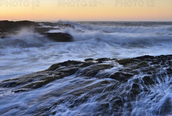Waves breaking on rocks on the coast