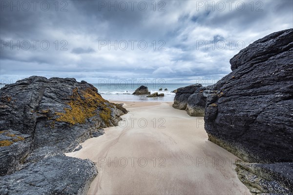 Rock with sandy beach in the bay of Sango Sands