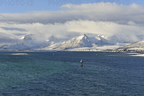 Snow-covered mountains with clouds