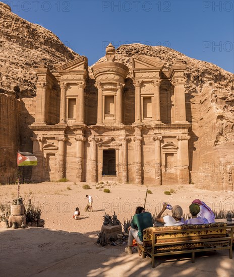 Tourists sitting on a bench