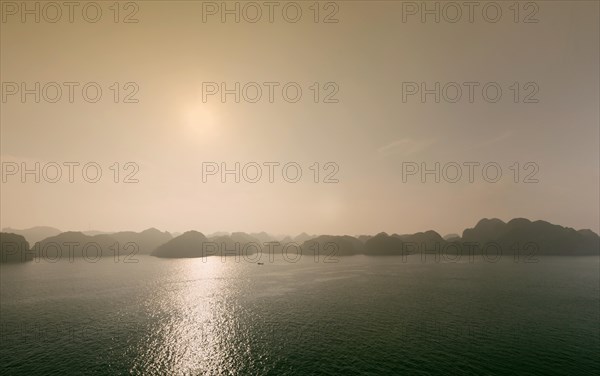 Limestone karst formations at sunset