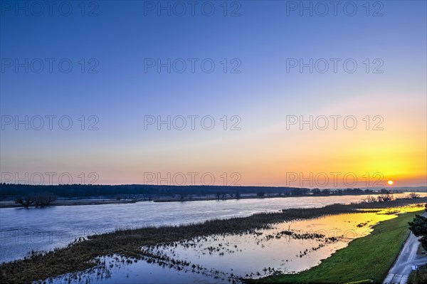 Sunset at the river Oder during flood