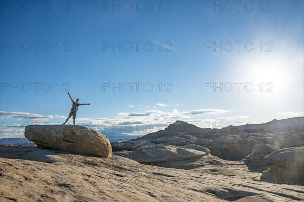 Young man standing on a rocky