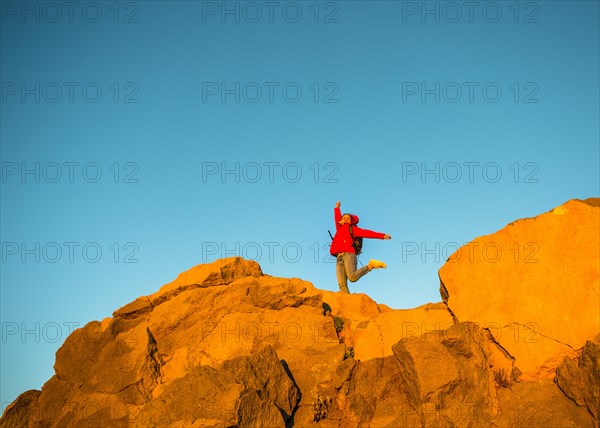 Young woman jumping in the air