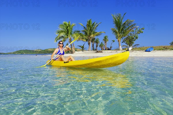 Woman in yellow kayak