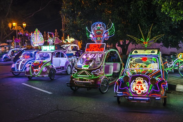 Cars illuminated with colourful LEDs