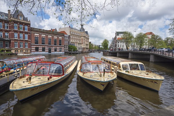 Canal boats on the Amstel river