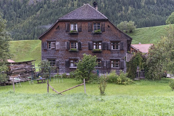 Old farmhouse with shingle facade