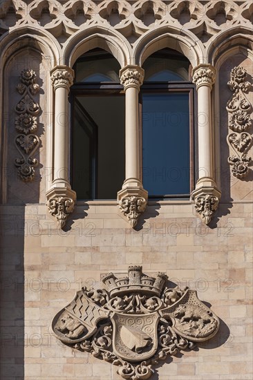 Arched windows and coats of arms