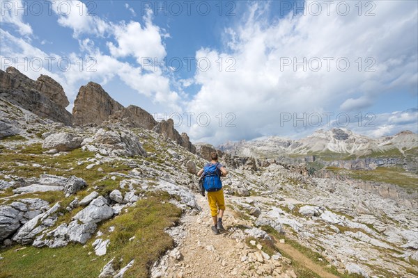 Hikers on the circular trail around the Sella Group