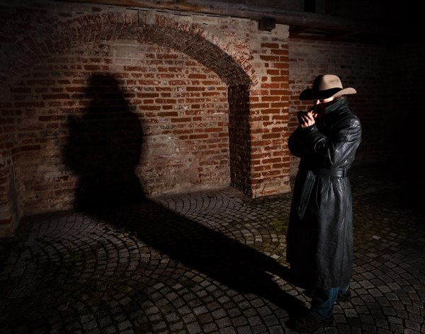 Man with hat and leather coat