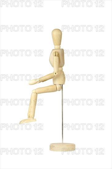 Wooden stickman seated