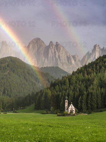 Rainbow in front of the church St. Johann in Ranui