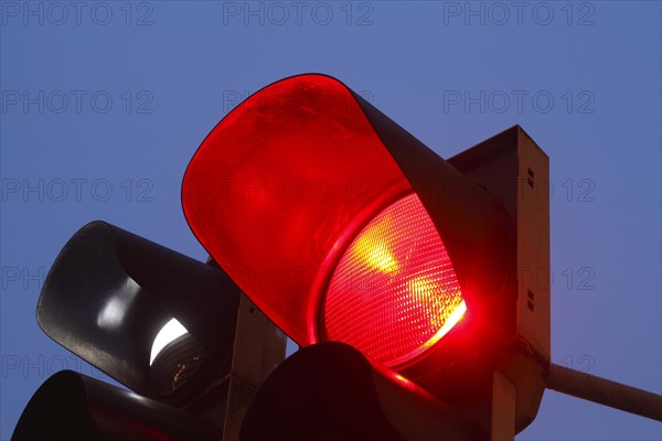 Red traffic lights at dusk