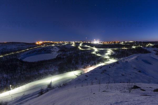 Lit cross-country ski trail at night