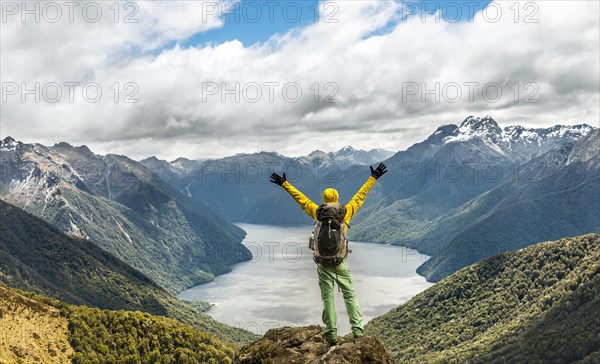 Hiker looking at the South Fiord of Lake Te Anau