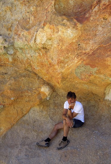 Man sits thoughtfully in Montana Amarilla