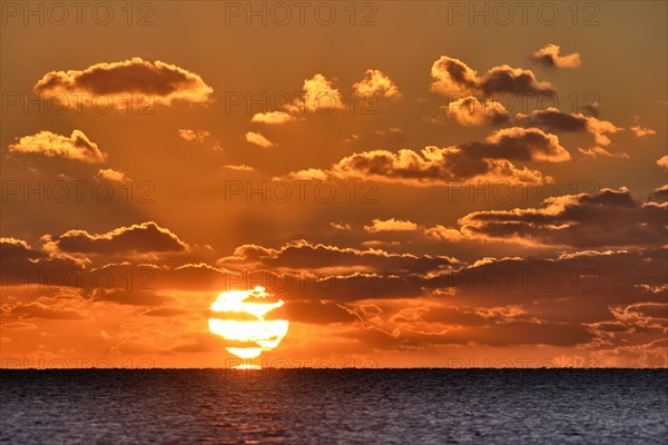 Sunset with cloudy sky above the North Sea