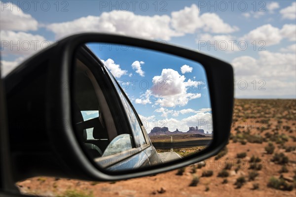 Look into the rear-view mirror of a car