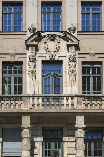 Facade with balcony and caryatids