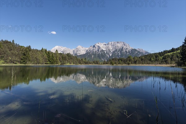 Western Karwendelspitze is reflected in the Luttensee