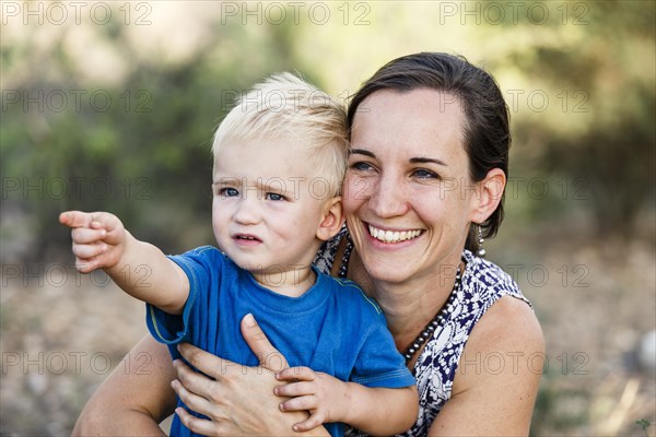 Little boy with mother pointing at something