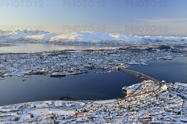 Snowy town with bridge