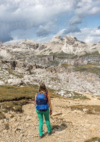 Woman on footpath to Passo Cir