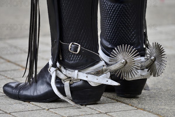 Man in riding boots with spurs