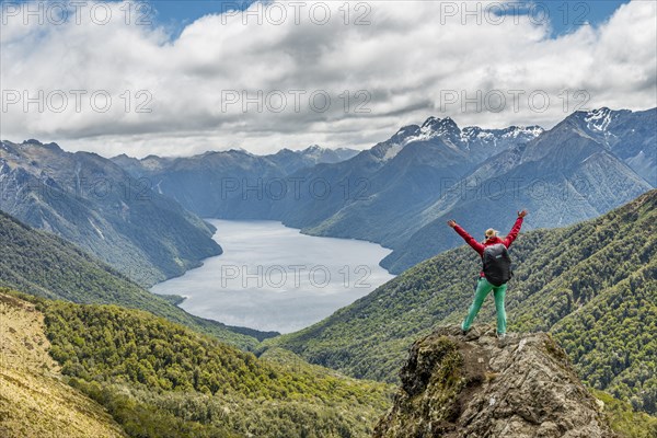 Female hiker looking at the South Fiord of Lake Te Anau