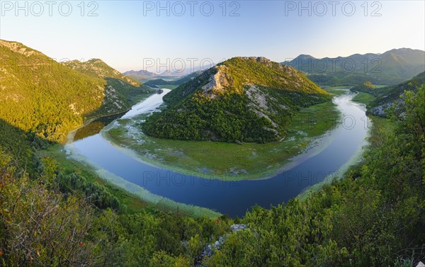 River bend of the river Rijeka Crnojevica in the evening light