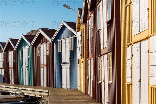 Colourful boathouses in the harbour of Smogen