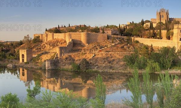 San Juan de los Reyes Church and city wall reflected in the River Tajo