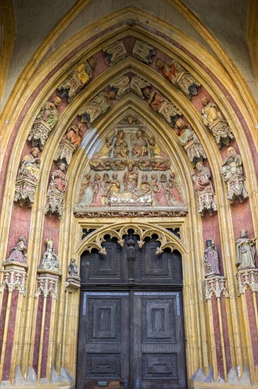 Tympanum with colorful painted sacred figures