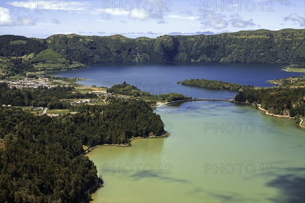 View from Miradouro da Vista do Rei into the volcanic crater Caldera Sete Cidades with the crater lakes Lagoa Verde and Lago Azul