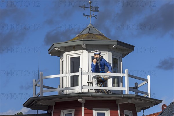 Figure of a captain on a tower