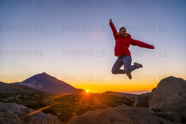 Young woman jumping in the air