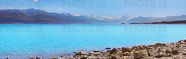 turquoise glacial Lake Pukaki with mountains