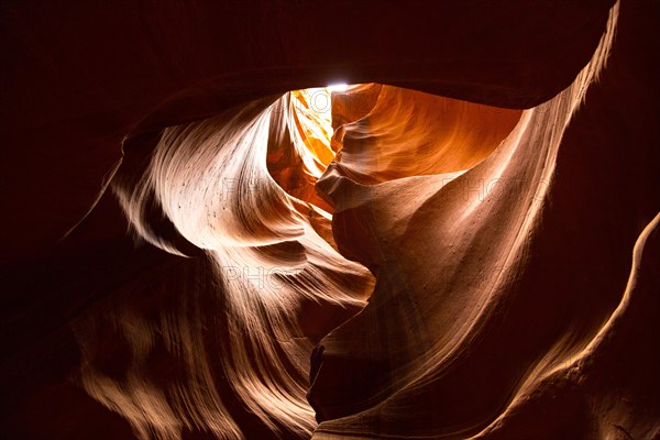 Light through heart shaped sandstone formation