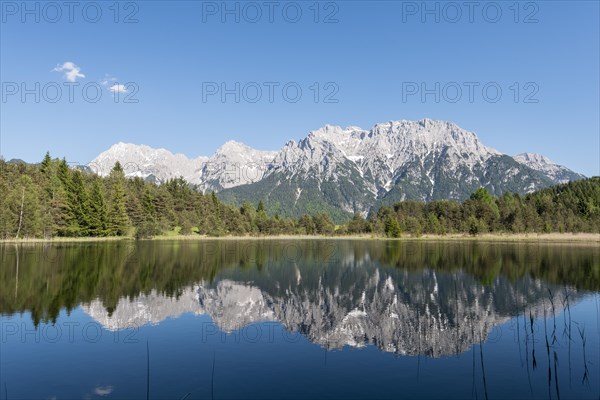 Western Karwendelspitze is reflected in the Luttensee