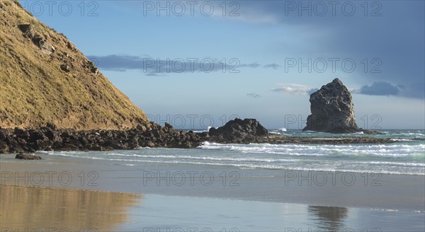Sandy beach with rocks in the sea