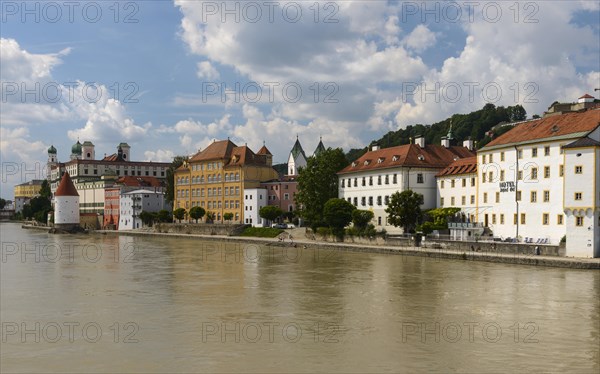 Jesuit church St. Michael and Schaiblingsturm on the quay of the Inn