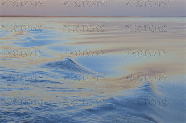 Wave pattern on the Brahmaputra river at sunset