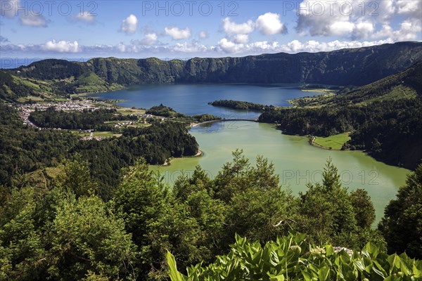 View from Miradouro da Vista do Rei into the volcanic crater Caldera Sete Cidades with the crater lakes Lagoa Verde and Lago Azul