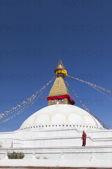 Monk at Buddhist stupa