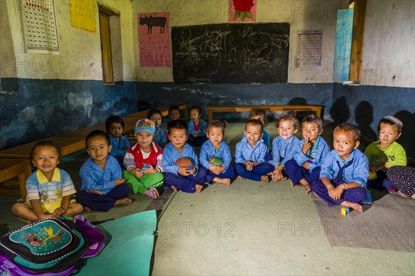 Group of children in blue dresses