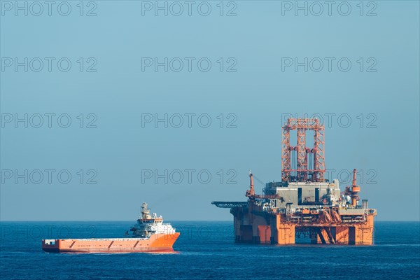 Supply vessel Normand Aurora next to West Phoenix oil rig